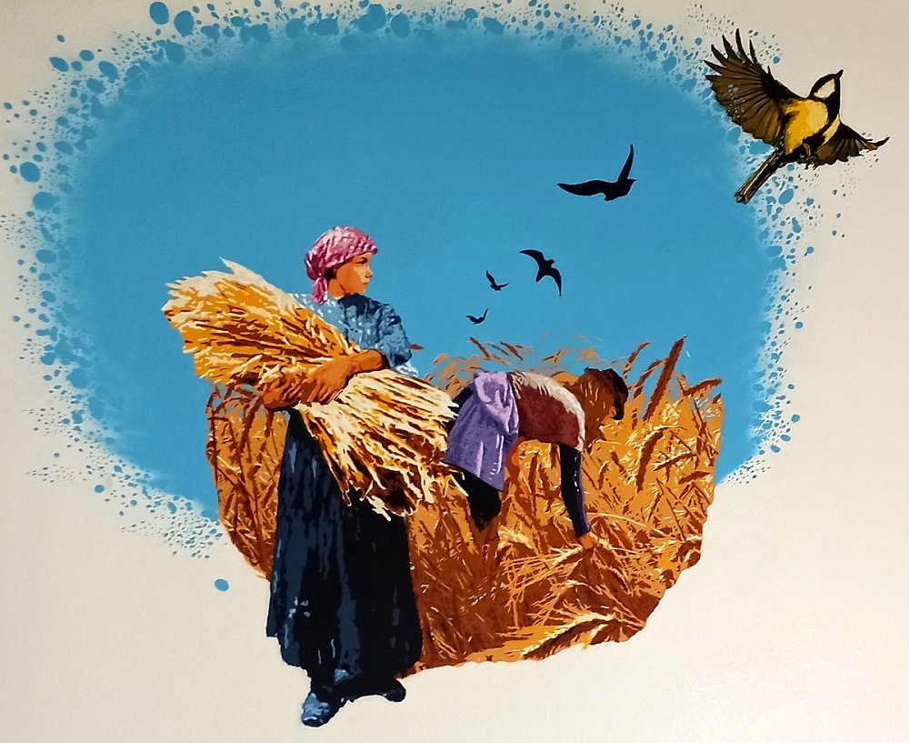 Mural das Ceifeiras no campo, no trabalho de apanha dos cereais. A pintura celebra a tradição e a origem do pão, realçando o trabalho manual inicial na Padaria A Ceifeira.